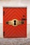 Small Red wooden door with large keyhole