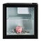 In a small refrigerator is a pink piggy bank on dollar bills, the concept of accumulation of finance and lending