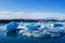 small remains of an iceberg floating in the sea