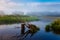 Small river curving green meadows at sunrise. Summer landscape