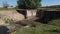 Small river dam of sideway channel of Vah river, Slovakia with visible inflow part, grate for filtering dirt and dirty water.