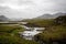 Small river streaming through the peat landscape.