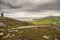 Small road to Malin head viewpoint and stunning scenery. Dark dramatic cloudy sky. Amazing Irish landscape. County Donegal,