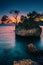 Small rocky island in the sea at sunset, Brela, Croatia