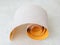 Small roll of extra coarse aluminum oxide sandpaper. Abrasive paper for dry sanding. Processing wood and metals, furniture