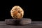 Small round dried pumpkin on a wooden board. Decorative vegetables for design and decoration. Dark background, copy space