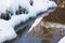 Small round icicles over water