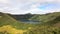 Small round lake inside the crater of the extinct volcano. Kamchatka Peninsula, Russia