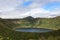 Small round lake inside the mountains. Kamchatka Peninsula, Russia