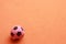 Small rubber ball on an orange background