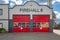 A small rural fire hall out in a country community. Exterior view of Firehall in BC Canada. Facade of the fire station