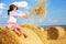 Small rural girl on harvest field