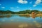 Small rustic shack reflected on the lakeside