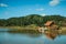 Small rustic shack reflected on the lakeside