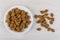 Small rye rusks in plate and scattered on wooden table