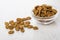 Small rye rusks in transparent bowl and scattered on table