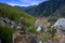 Small sacred cairns made of stones, laid at the entrance to a fertile mountain valley