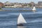 Small sailboat leaving Fairhaven under sail