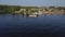 A small sailboat and a pier on the lake. Walk on water. Aerial view.