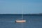 Small sailboat in the water near the coast of Denmark