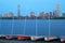 Small sailboats line up on the docks on the Charles River across from Boston