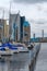 Small sailing boats in Halmstad port with industrial buildings in background