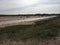 Small sailing boats moored at low tide, on the Norfolk coast estuary