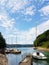 Small sailing yachts of coastal navigation are moored at the pier in a picturesque harbor. Prestigious and healthy lifestyle. Recr