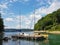 Small sailing yachts of coastal navigation are moored at the pier in a picturesque harbor. Prestigious and healthy lifestyle. Recr