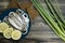 Small salted fish of Baltic herring, sprats on a wooden table. Top view