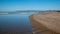 Small sandbar where the Pacific ocean and the Santa Clara river meet at Surfers Knoll beach in Ventura California USA