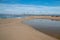 Small sandbar where the Pacific ocean and the Santa Clara river meet at Surfers Knoll beach in Ventura California USA