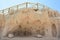 Small sandstone caves with wooden walkway, Cala Conta, Ibiza.