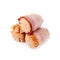 Small sausages wrapped in a blanket of smoked streaky bacon isolated on white background