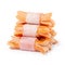 Small sausages wrapped in a blanket of smoked streaky bacon isolated on white background