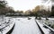 A small scenic garden covered by snow in Victoria Park, Aberdeen, Scotland