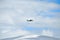 Small school airplane climbing on blue sky