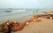 Small sea fishing boat next to fishing nets drying on Nilaveli beach in Trincomalee Sri Lanka