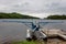 Small seaplane moored to a floating wooden pontoon near the shore of a mountain lake. Adirondacks, NY