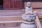 Small seated Buddha on ornamental plinth