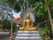 A small seated Buddha statue at Wat Doi Saket in northern Thailand