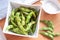 Small serving of green Edamame Peas sprinkled with salt