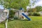 Small set of playground on a green lawn at the fenced backyard at Utah