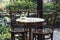 Small set tables in cafe with Antique chair thaistyle. Details of an interior