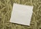 small sheet of blank white rag paper against art paper background