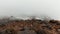 Small shelter for climbers located in mountains on a foggy and cloudy day, time lapse effect. Clip. Refuge for alpinist