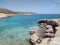 A small shingle beach on the quiet Greek island of Donousa. Crystal clear blue waters.