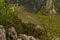 Small ship crossing the Danube through high cliffs