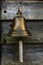 Small ships bell hanging outside a house