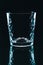 Small shot glass on black background.